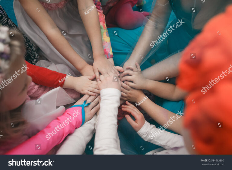 kids holding hands around world Children holding hands around the world royalty free vector