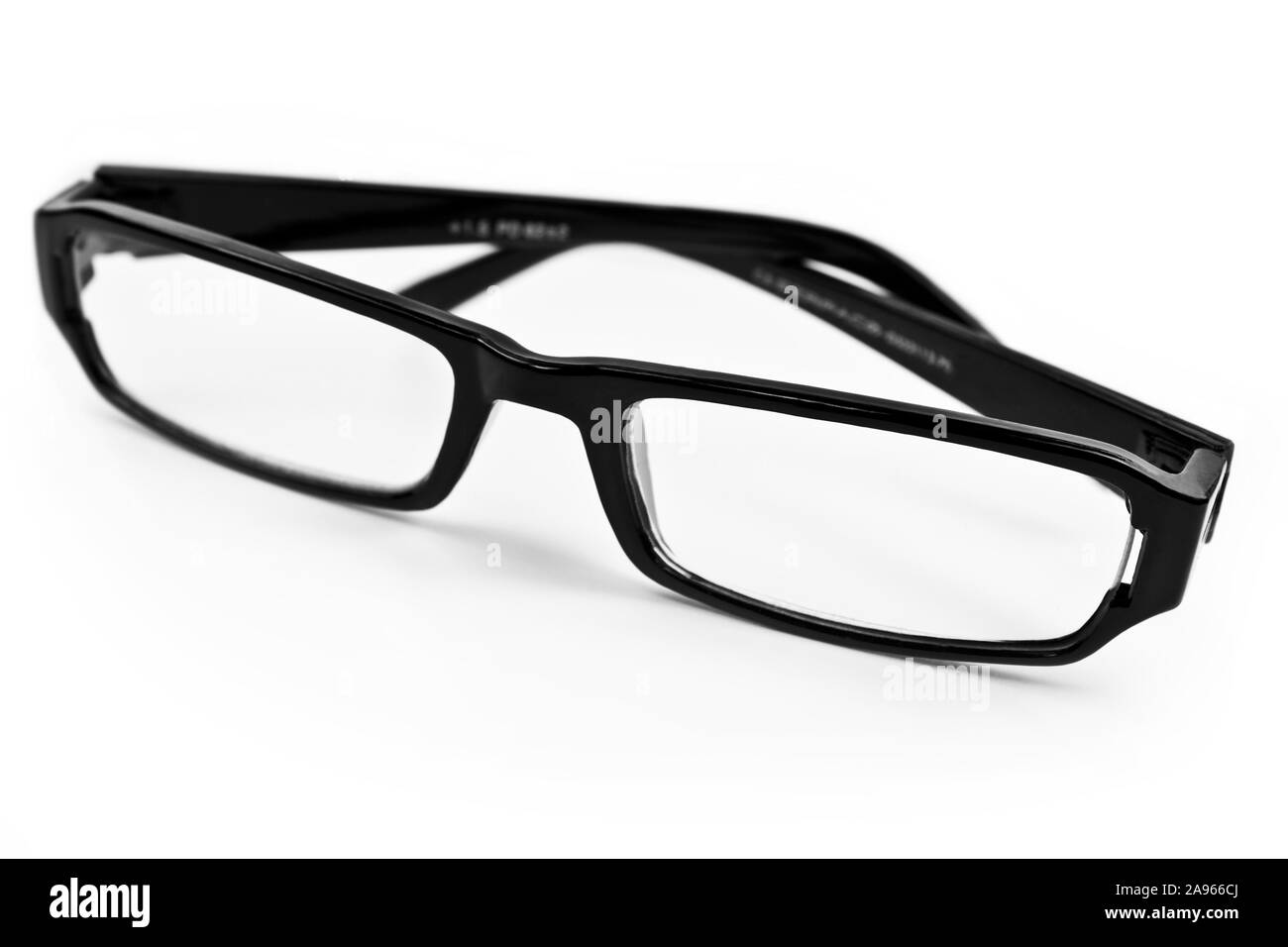 Black glasses on a clean white background, showcasing their sleek design and clarity.