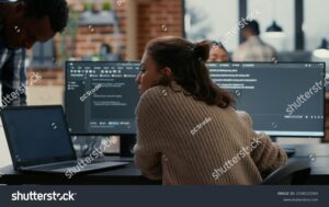 laptop in modern office coding A modern laptop from an angle in the office interior stock illustration